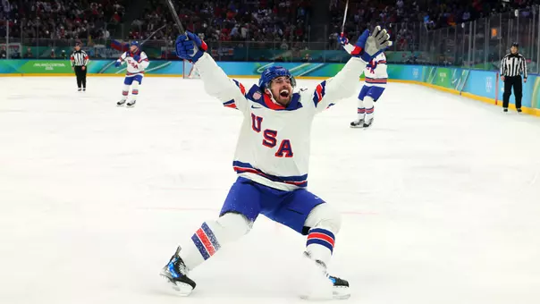 Dylan Larkin #21 of Team United States celebrates after scoring a goal in the first period during the Men's Semifinals Playoff match between the United States and Slovakia on day fourteen of the Milano Cortina 2026 Winter Olympic games at Milano Santagiulia Ice Hockey Arena on February 20, 2026 in Milan, Italy (Getty Images)
