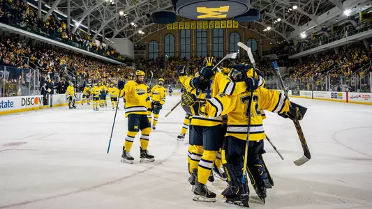 Ice hockey team celebration on the ice at Yost Ice Arena