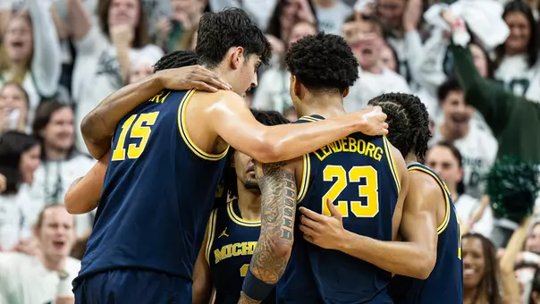 Men's basketball on-court team huddle