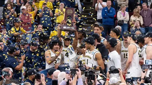 Men's basketball team on-court celebration following Final Four win