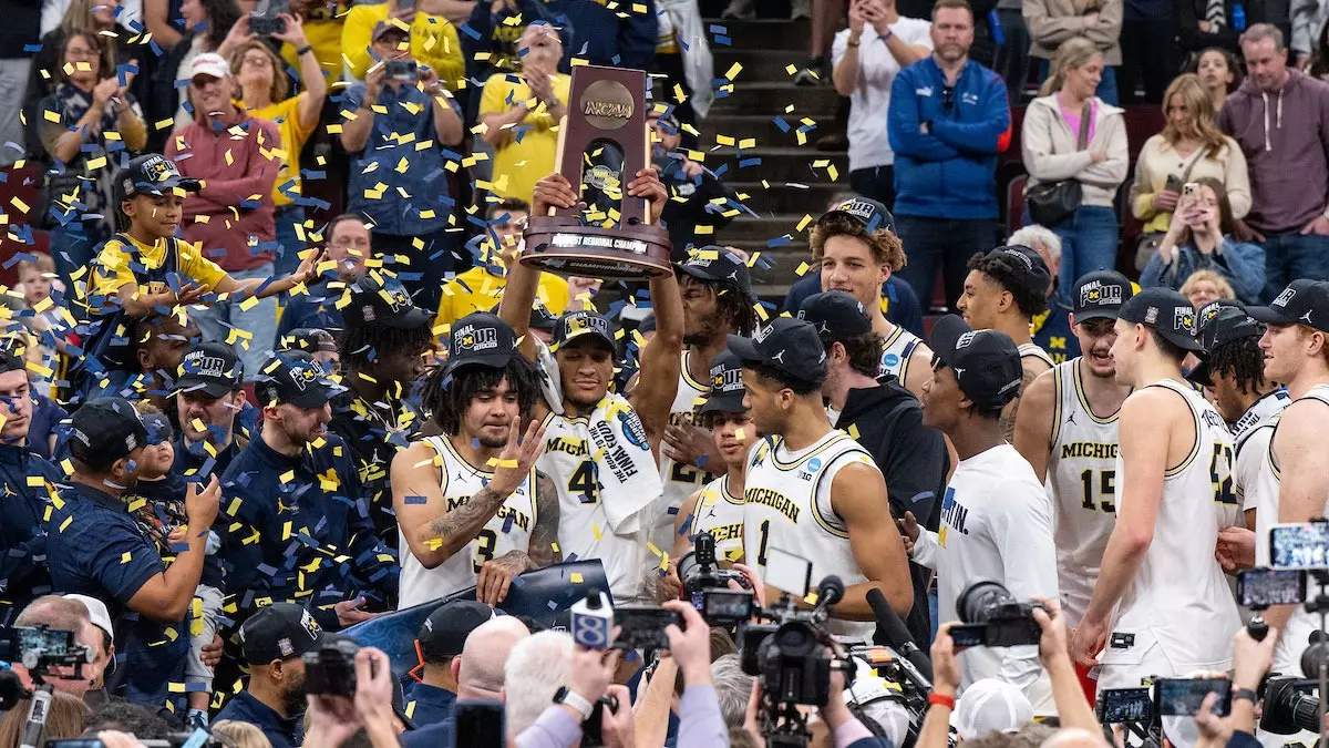 Men's basketball team on-court celebration following Final Four win