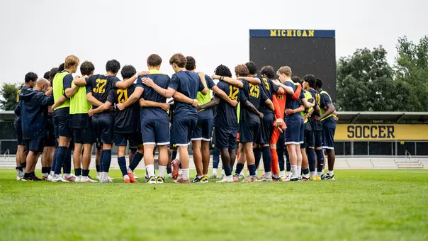 Men's soccer team huddle