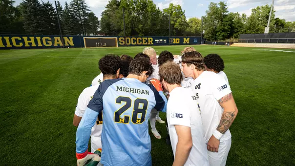 Men's soccer team huddle