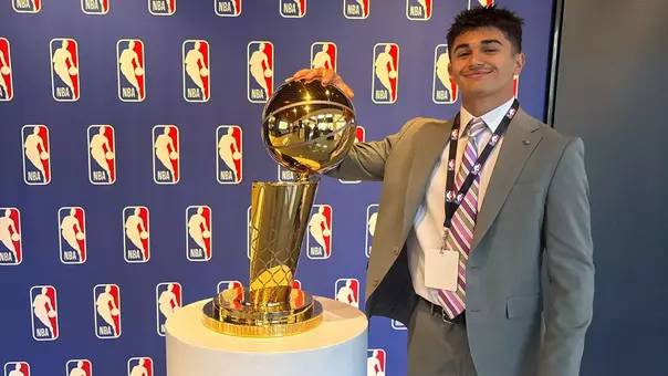 Jake Islam with the Larry O'Brien Trophy