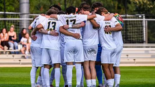 Men's soccer team huddle