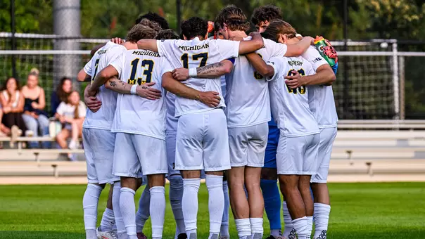 Men's soccer team huddle