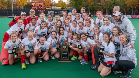 Field Hockey Team with trophy