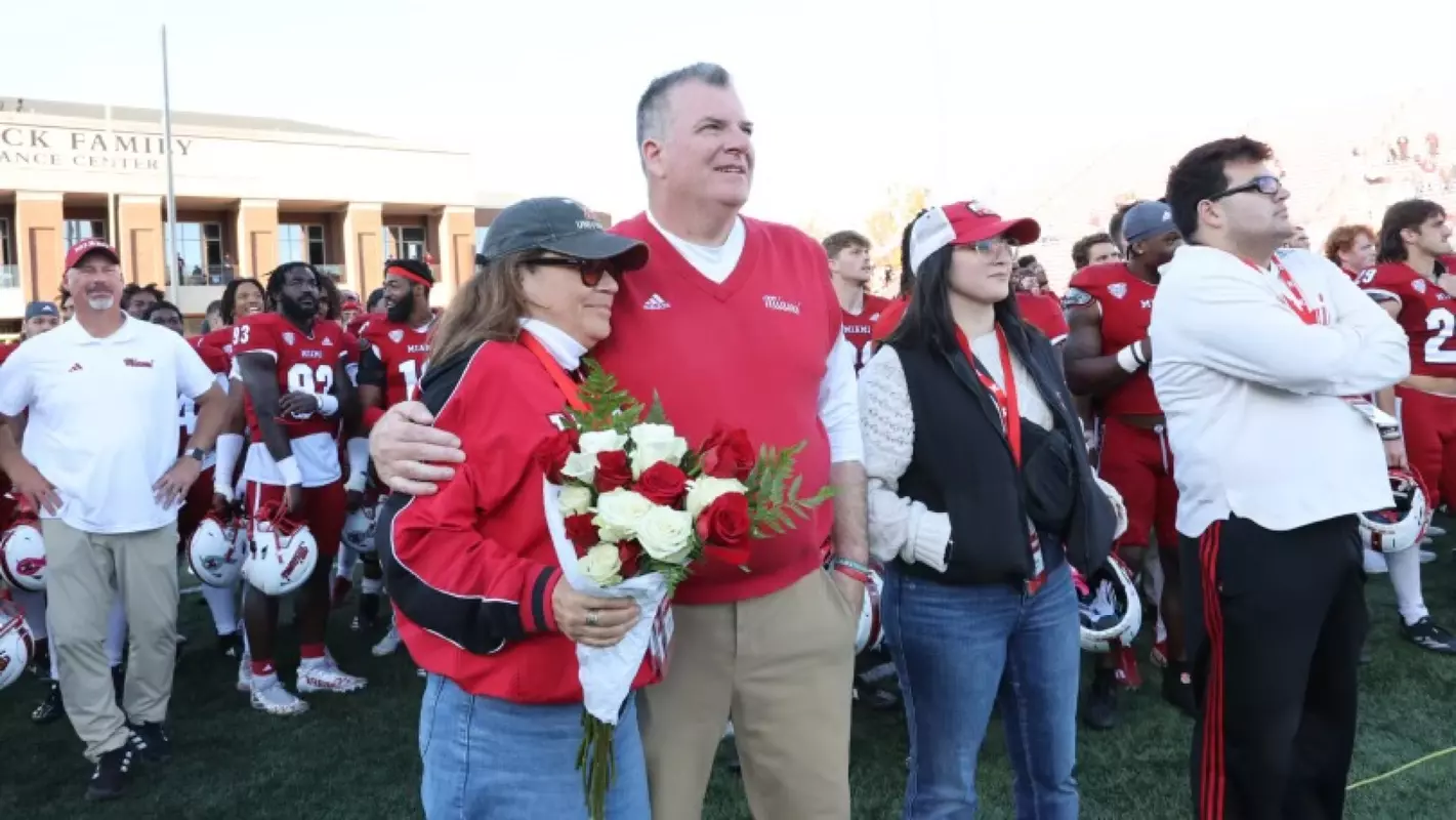 Chuck Martin and family after his 60th win as Miami head coach