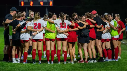 Miami Soccer team huddle
