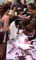Missouri State and TCU signed posters for kids after the free swim clinic that followed the first day of the dual meet Saturday