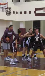 Assistant coach Jon Harper directs a drill