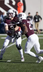 Brodie Lambert hands the ball off to Ryan Heaston