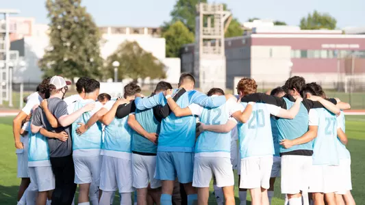 Men's soccer team huddle
