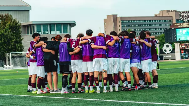 Men's Soccer Group Huddle