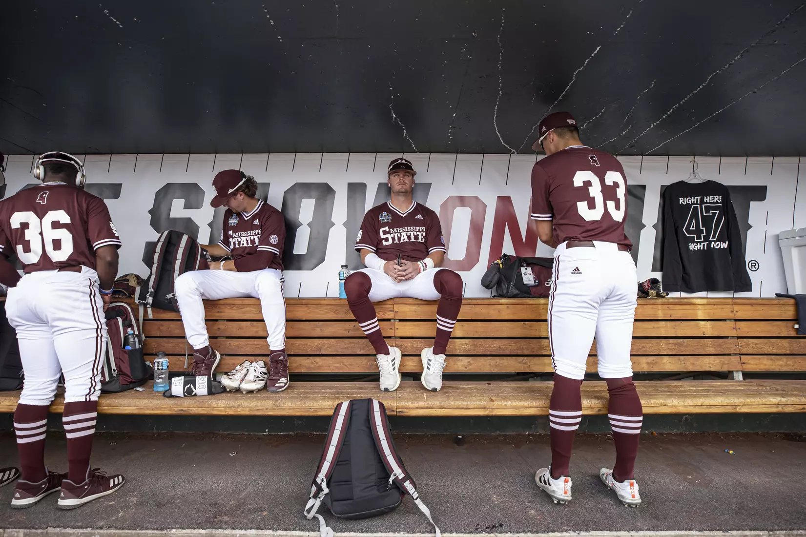 OMAHA, NE - June 22, 2021 - Mississippi State Outfielder Tanner Allen (#5) listens to music in the dugout before the 2021 Mens College World Series game between the Mississippi State Bulldogs and the Virginia Cavaliers at TD Ameritrade Park in Omaha, NE. Photo By Austin Perryman