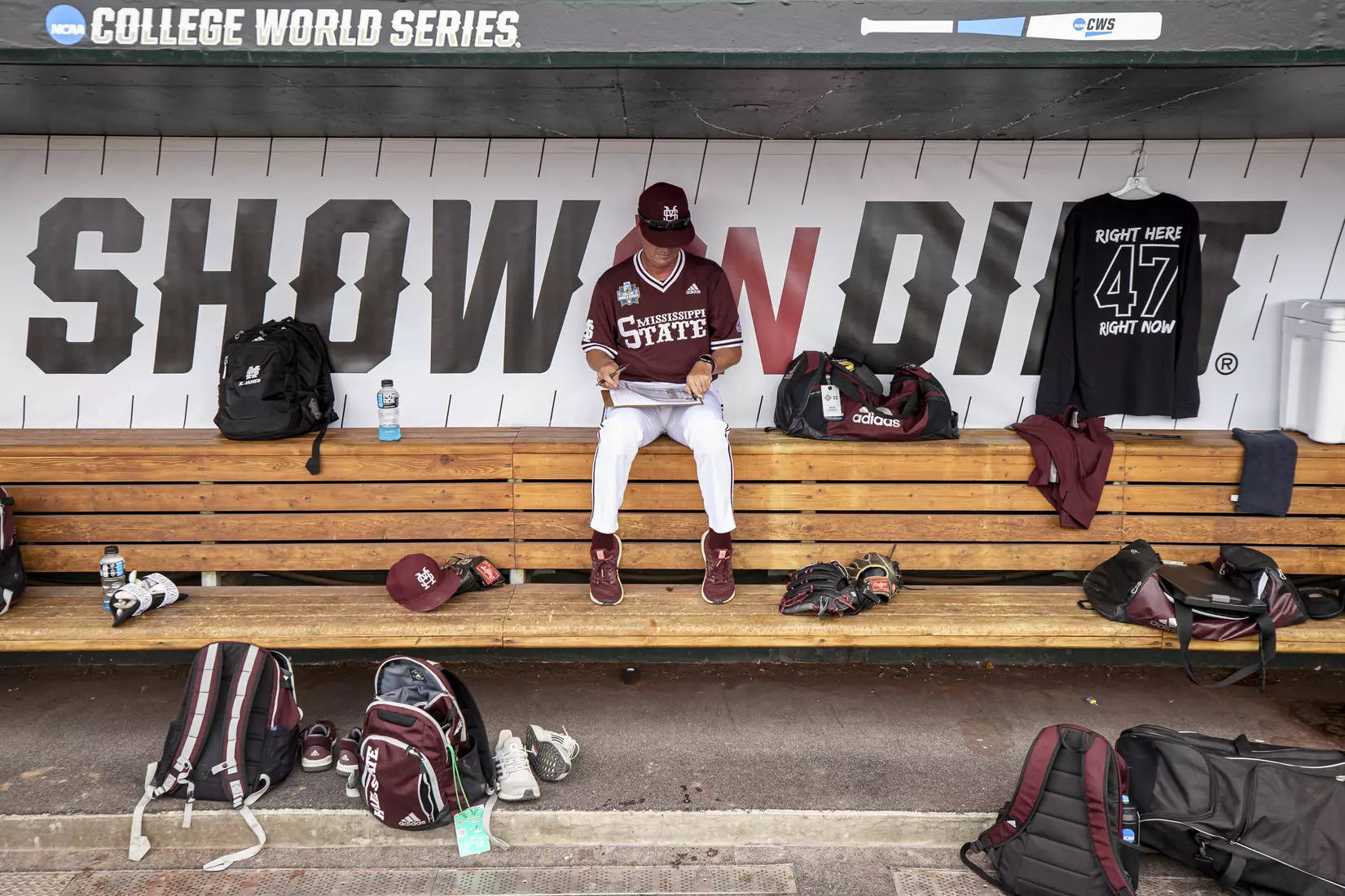 OMAHA, NE - June 22, 2021 - Mississippi State Assistant Coach Scott Foxhall in the dugout before the 2021 Mens College World Series game between the Mississippi State Bulldogs and the Virginia Cavaliers at TD Ameritrade Park in Omaha, NE. Photo By Austin Perryman