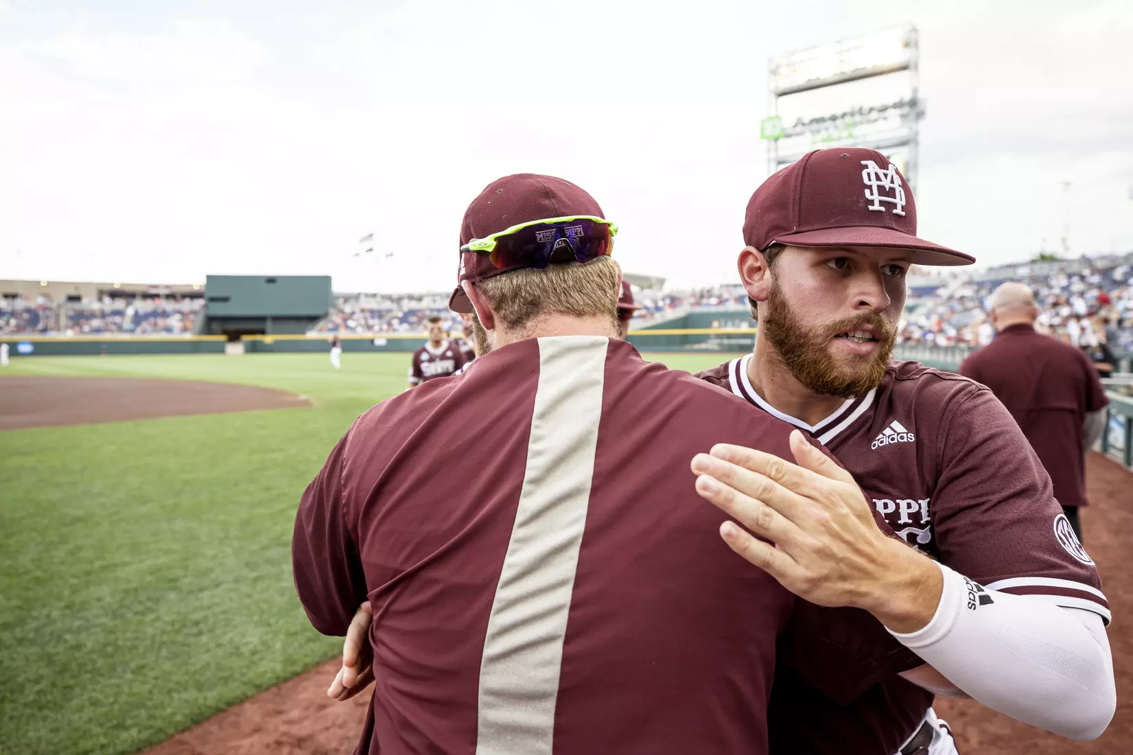 OMAHA, NE - June 22, 2021 - Mississippi State Manager Gavin Schmidt and Infielder Luke Hancock (#20) before the 2021 Mens College World Series game between the Mississippi State Bulldogs and the Virginia Cavaliers at TD Ameritrade Park in Omaha, NE. Photo By Austin Perryman