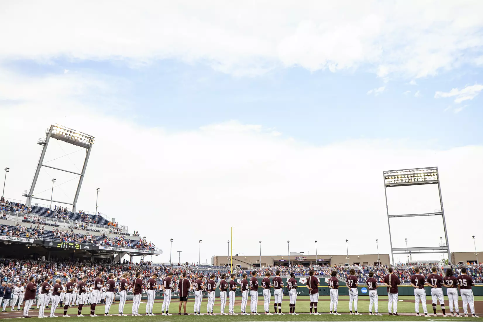 OMAHA, NE - June 22, 2021 - The Mississippi State Bulldogs during the National Anthem before the 2021 Mens College World Series game between the Mississippi State Bulldogs and the Virginia Cavaliers at TD Ameritrade Park in Omaha, NE. Photo By Austin Perryman