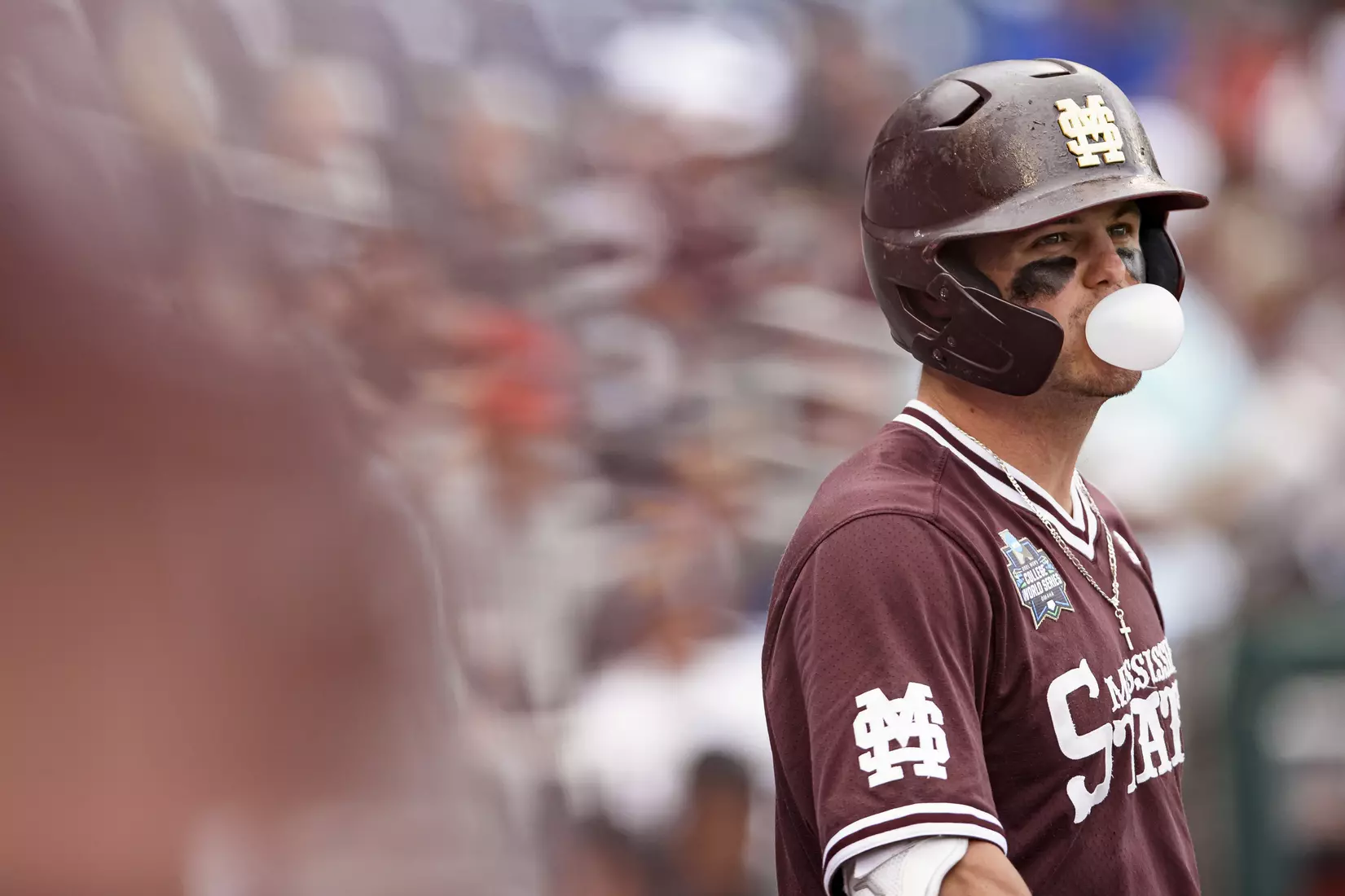 OMAHA, NE - June 22, 2021 - Mississippi State Outfielder Tanner Allen (#5) blows a bubble during the 2021 Mens College World Series game between the Mississippi State Bulldogs and the Virginia Cavaliers at TD Ameritrade Park in Omaha, NE. Photo By Austin Perryman