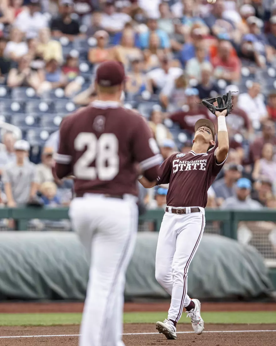 OMAHA, NE - June 22, 2021 - Mississippi State Infielder Kamren James (#6) catches a pop fly during the 2021 Mens College World Series game between the Mississippi State Bulldogs and the Virginia Cavaliers at TD Ameritrade Park in Omaha, NE. Photo By Austin Perryman