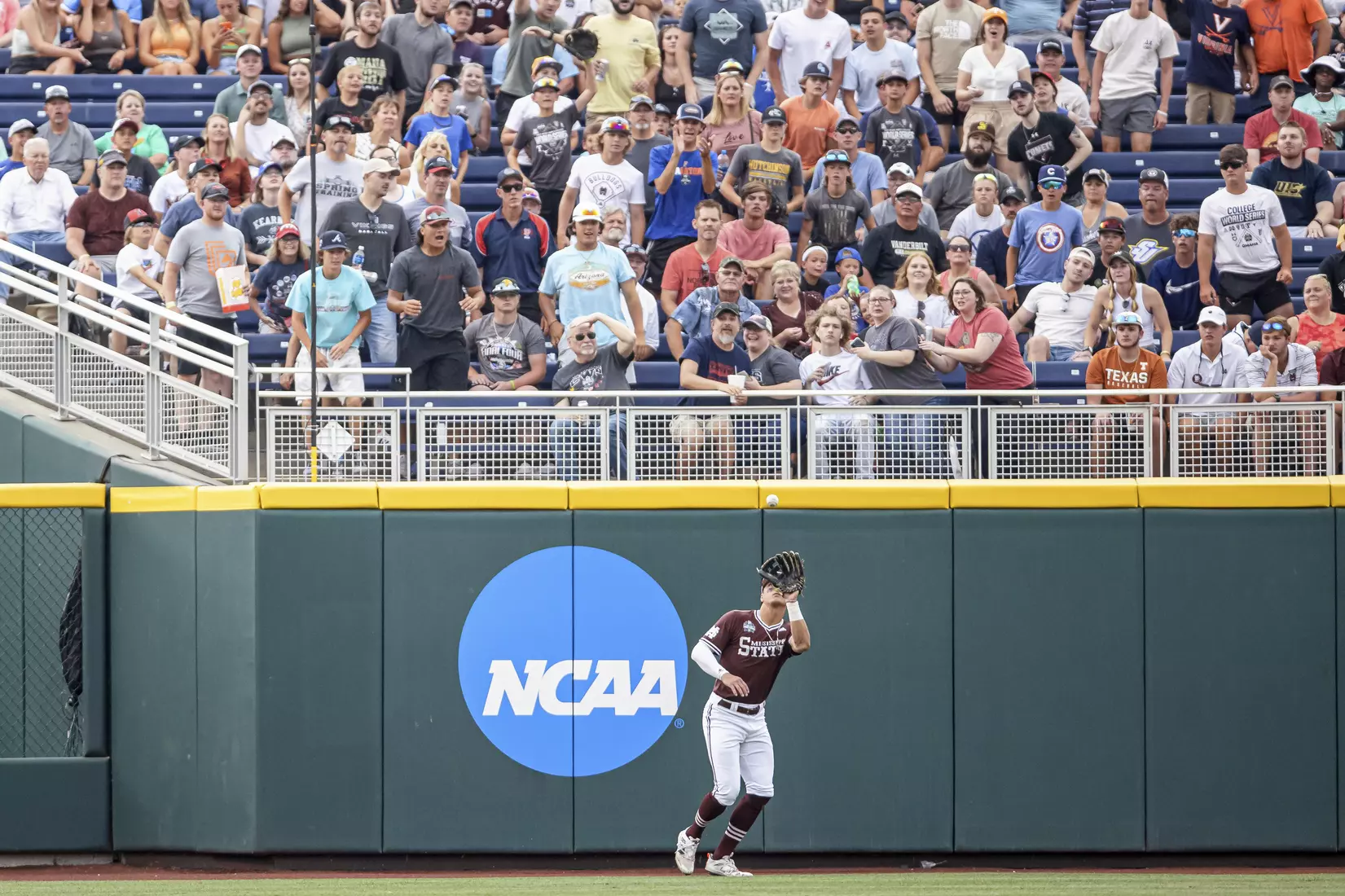 OMAHA, NE - June 22, 2021 - Mississippi State Outfielder Brad Cumbest (#33) catches a pop fly during the 2021 Mens College World Series game between the Mississippi State Bulldogs and the Virginia Cavaliers at TD Ameritrade Park in Omaha, NE. Photo By Austin Perryman