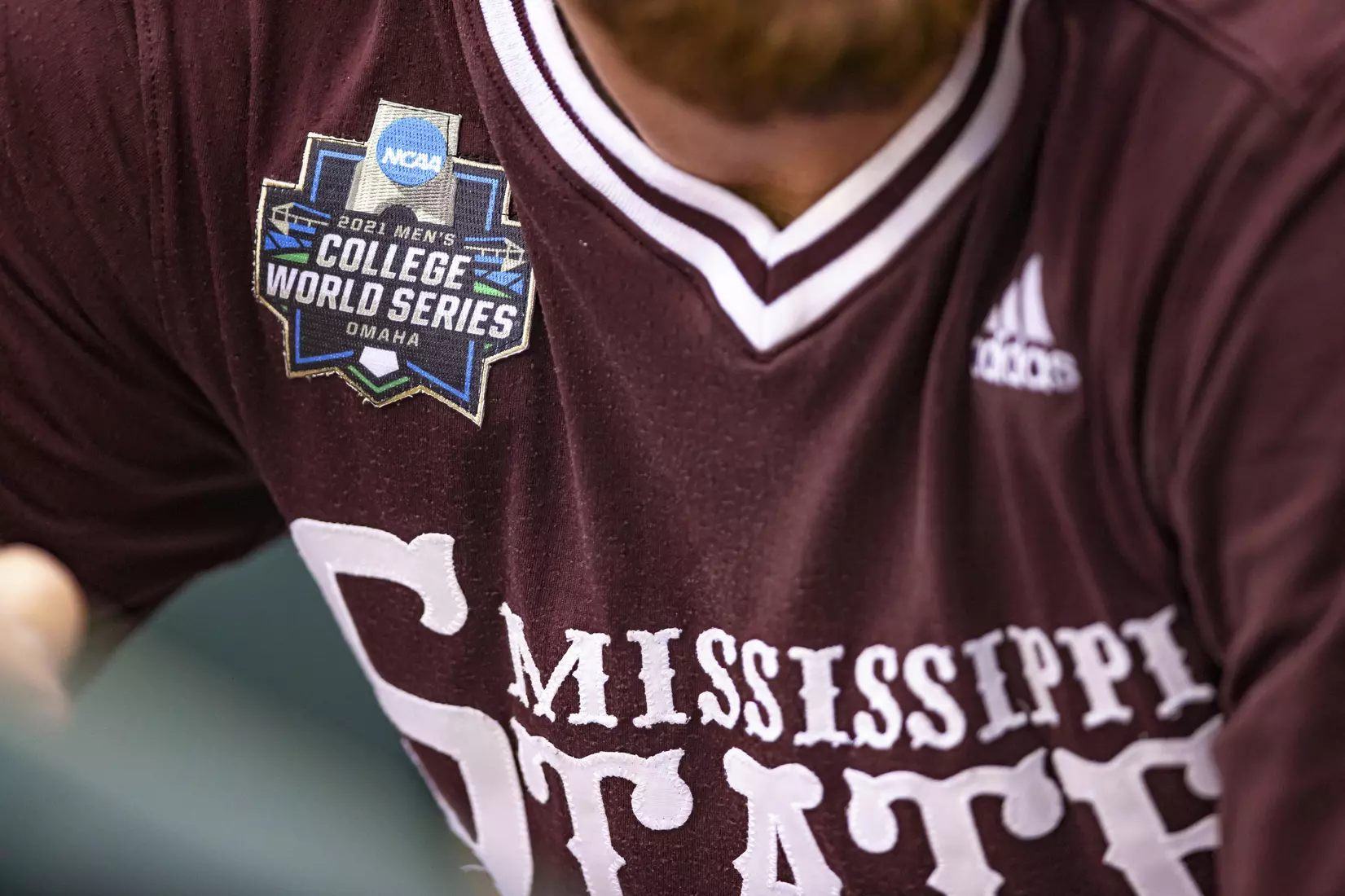 OMAHA, NE - June 22, 2021 - A 2021 Mens College World Series patch is on a maroon 85 jersey during the 2021 Mens College World Series game between the Mississippi State Bulldogs and the Virginia Cavaliers at TD Ameritrade Park in Omaha, NE. Photo By Austin Perryman