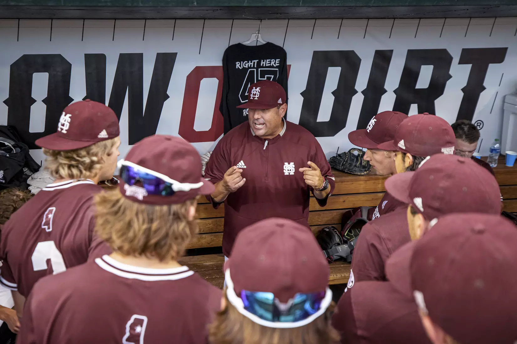 OMAHA, NE - June 22, 2021 - Mississippi State Head Coach Chris Lemonis speaks to the team in the dugout during the 2021 Mens College World Series game between the Mississippi State Bulldogs and the Virginia Cavaliers at TD Ameritrade Park in Omaha, NE. Photo By Austin Perryman