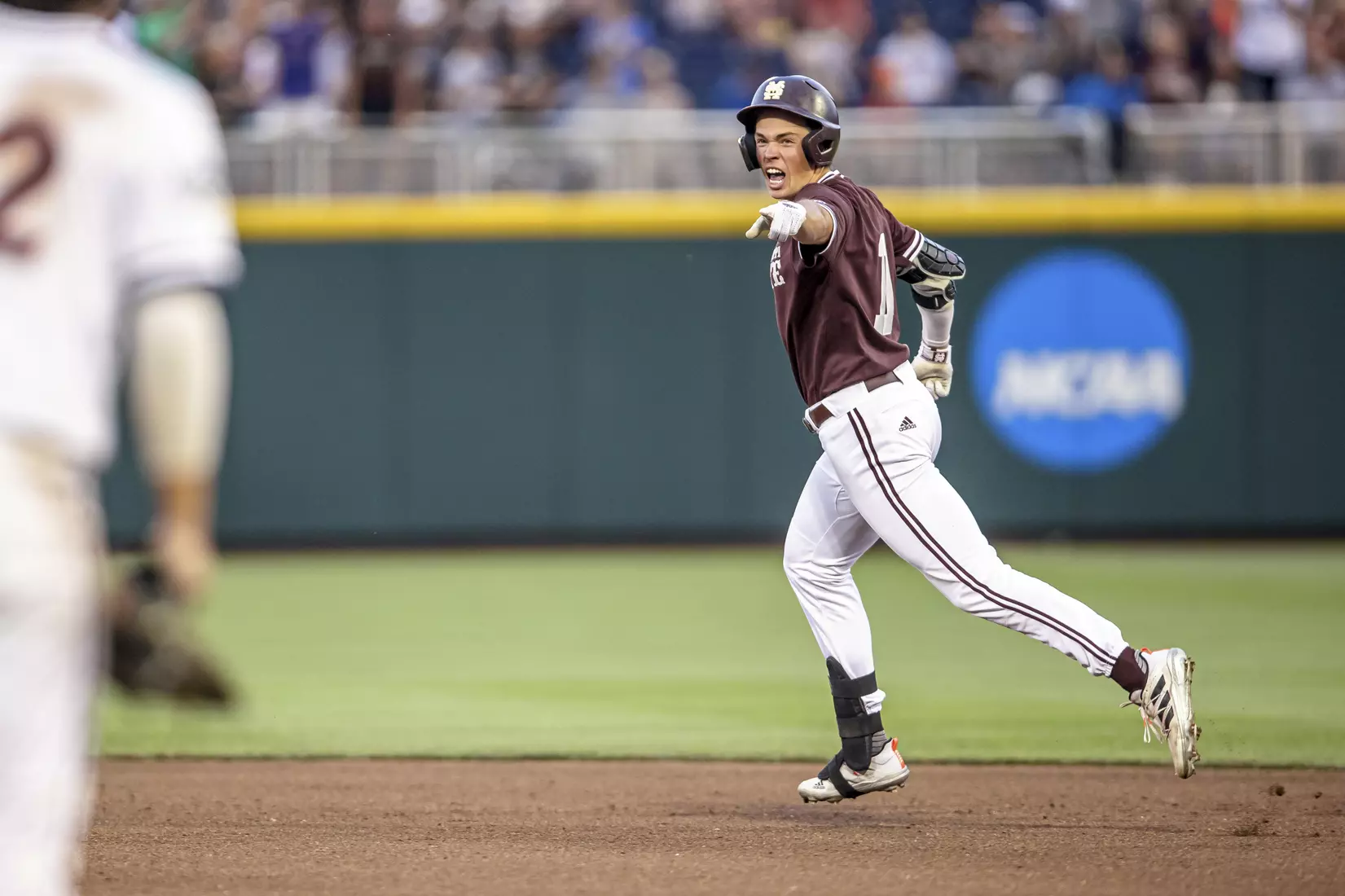 OMAHA, NE - June 22, 2021 - Mississippi State Outfielder Kellum Clark (#11) celebrates after hitting a home run during the 2021 Mens College World Series game between the Mississippi State Bulldogs and the Virginia Cavaliers at TD Ameritrade Park in Omaha, NE. Photo By Austin Perryman