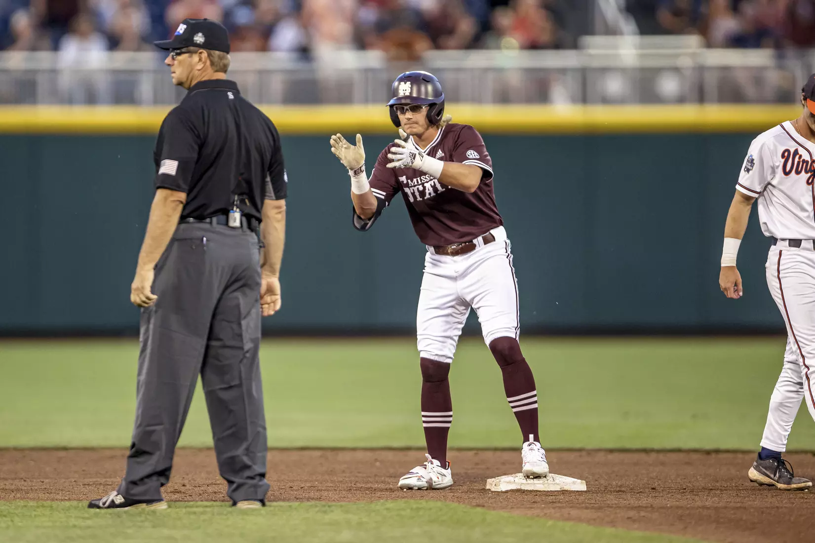 OMAHA, NE - June 22, 2021 - Mississippi State Outfielder Rowdey Jordan (#4) celebrates during the 2021 Mens College World Series game between the Mississippi State Bulldogs and the Virginia Cavaliers at TD Ameritrade Park in Omaha, NE. Photo By Austin Perryman