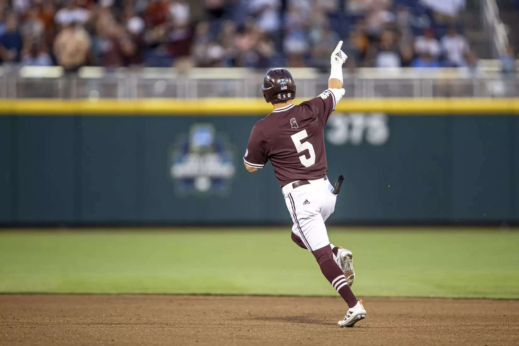 OMAHA, NE - June 22, 2021 - Mississippi State Outfielder Tanner Allen (#5) celebrates after hitting a home run during the 2021 Mens College World Series game between the Mississippi State Bulldogs and the Virginia Cavaliers at TD Ameritrade Park in Omaha, NE. Photo By Austin Perryman