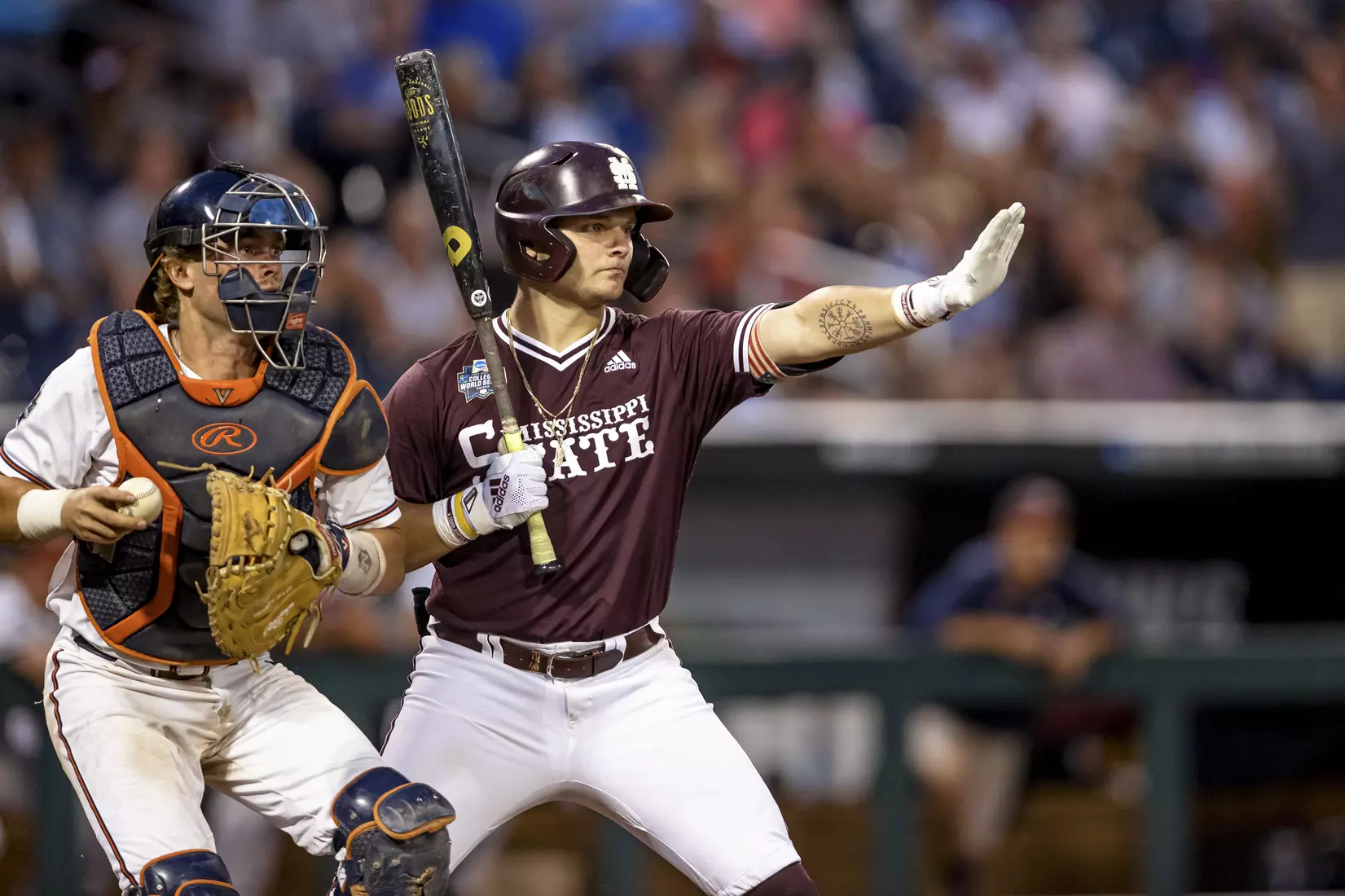 OMAHA, NE - June 22, 2021 - Mississippi State Catcher Logan Tanner (#19) signals to a baserunner during the 2021 Mens College World Series game between the Mississippi State Bulldogs and the Virginia Cavaliers at TD Ameritrade Park in Omaha, NE. Photo By Austin Perryman