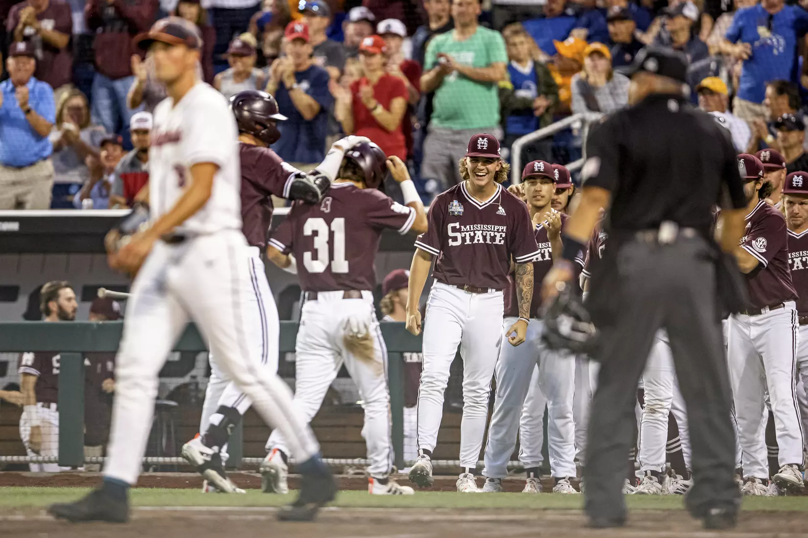 OMAHA, NE - June 22, 2021 - Mississippi State Pitcher Jackson Fristoe (#27) celebrates during the 2021 Mens College World Series game between the Mississippi State Bulldogs and the Virginia Cavaliers at TD Ameritrade Park in Omaha, NE. Photo By Austin Perryman