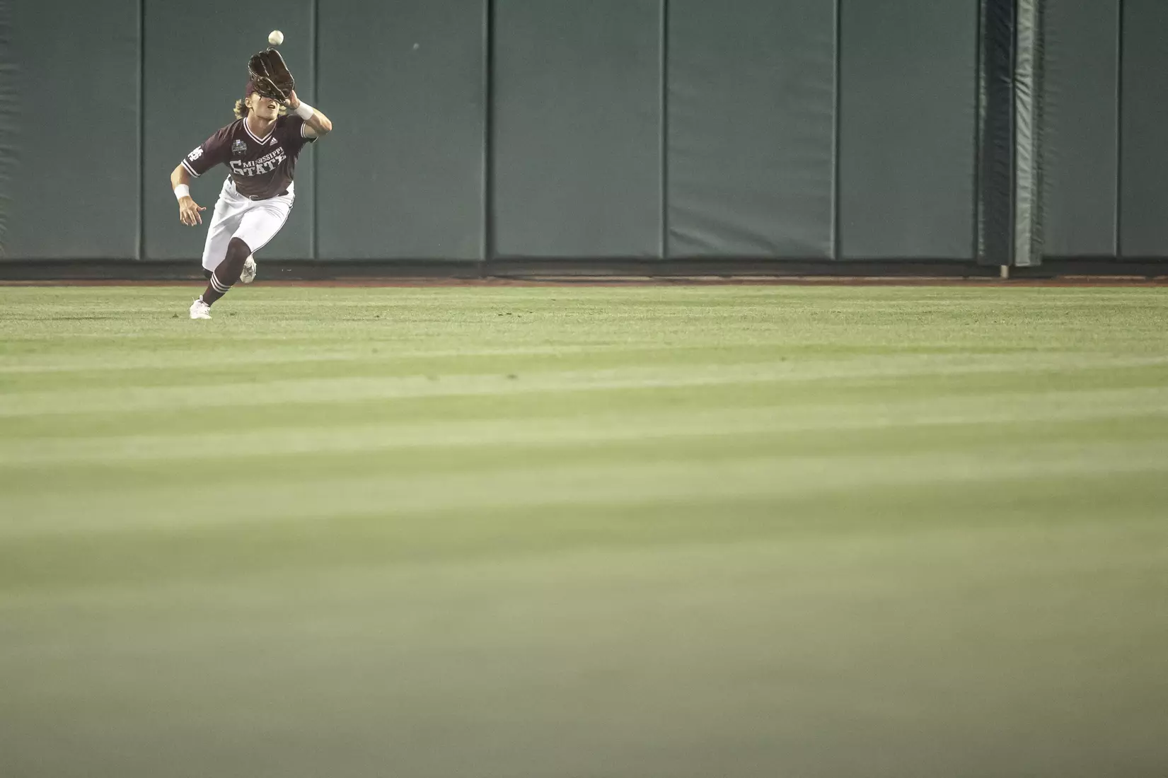 OMAHA, NE - June 22, 2021 - Mississippi State Outfielder Rowdey Jordan (#4) catches a pop fly during the 2021 Mens College World Series game between the Mississippi State Bulldogs and the Virginia Cavaliers at TD Ameritrade Park in Omaha, NE. Photo By Austin Perryman
