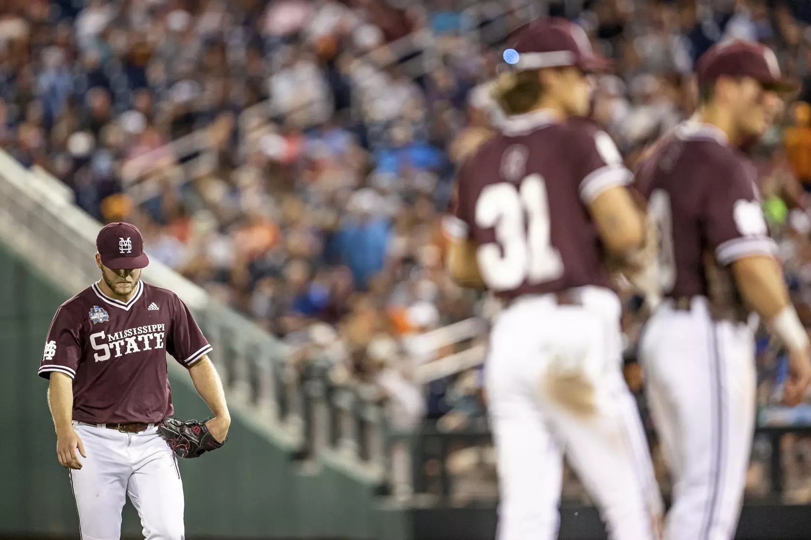 OMAHA, NE - June 22, 2021 - Mississippi State Pitcher Landon Sims (#23) enters the game during the 2021 Mens College World Series game between the Mississippi State Bulldogs and the Virginia Cavaliers at TD Ameritrade Park in Omaha, NE. Photo By Austin Perryman
