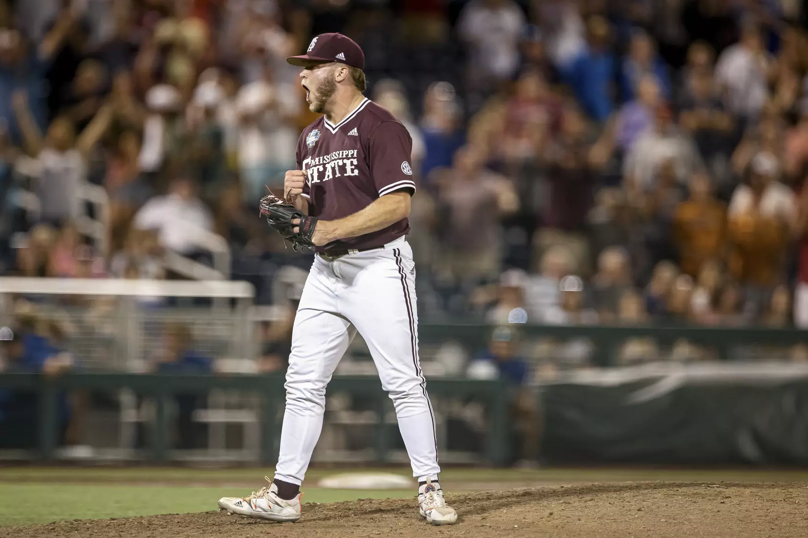 OMAHA, NE - June 22, 2021 - Mississippi State Pitcher Landon Sims (#23) celebrates after the 2021 Mens College World Series game between the Mississippi State Bulldogs and the Virginia Cavaliers at TD Ameritrade Park in Omaha, NE. Photo By Austin Perryman