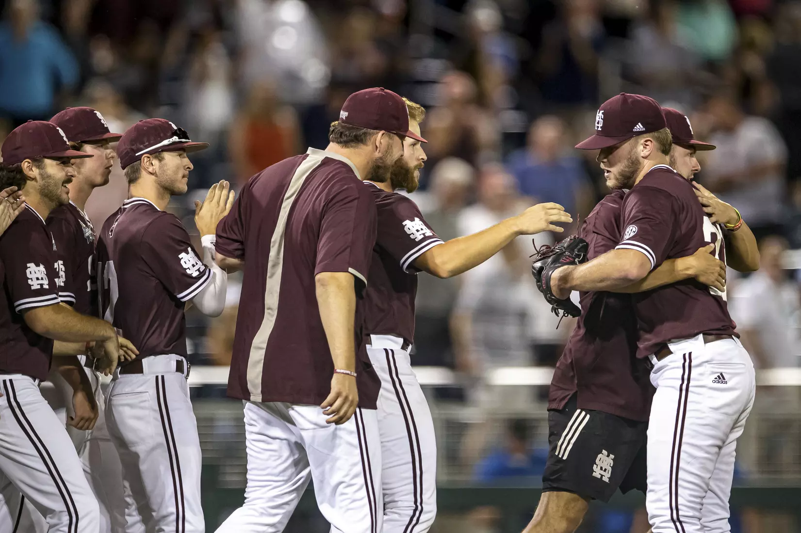 OMAHA, NE - June 22, 2021 - Mississippi State Pitcher Landon Sims (#23) and the Bulldogs celebrate after the 2021 Mens College World Series game between the Mississippi State Bulldogs and the Virginia Cavaliers at TD Ameritrade Park in Omaha, NE. Photo By Austin Perryman