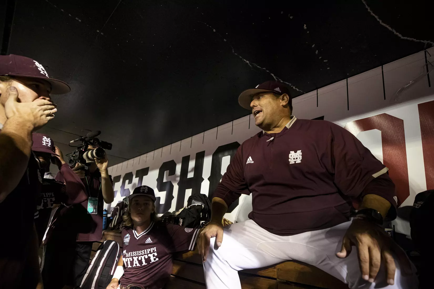 OMAHA, NE - June 22, 2021 - Mississippi State Head Coach Chris Lemonis speaks to the team in the dugout after the 2021 Mens College World Series game between the Mississippi State Bulldogs and the Virginia Cavaliers at TD Ameritrade Park in Omaha, NE. Photo By Austin Perryman