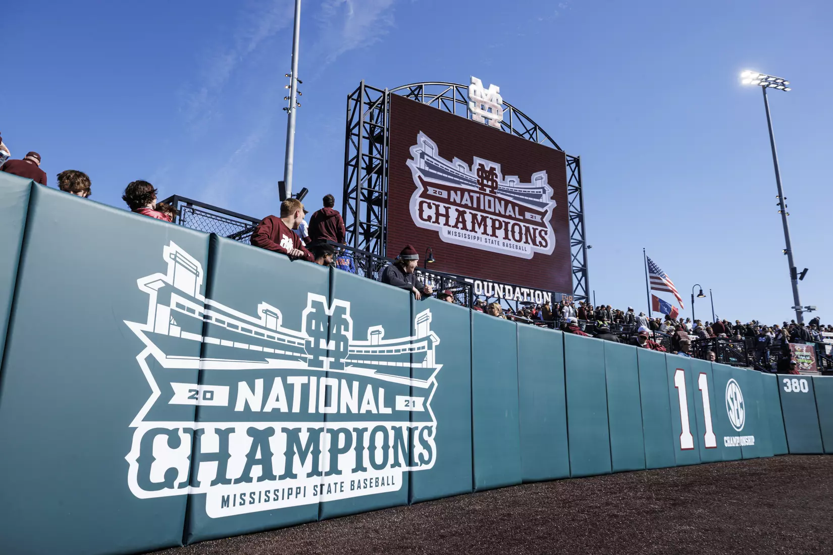 STARKVILLE, MS - February 18, 2022 - National Championship banner on the centerfield fence is unveiled before the game between the Long Beach State Dirtbags and the Mississippi State Bulldogs at Dudy Noble Field at Polk-Dement Stadium in Starkville, MS. Photo By Kevin Snyder