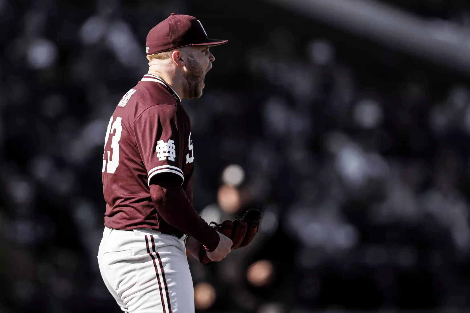 STARKVILLE, MS - February 18, 2022 - Mississippi State Pitcher Landon Sims (#23) celebrates during the game between the Long Beach State Dirtbags and the Mississippi State Bulldogs at Dudy Noble Field at Polk-Dement Stadium in Starkville, MS. Photo By Austin Perryman