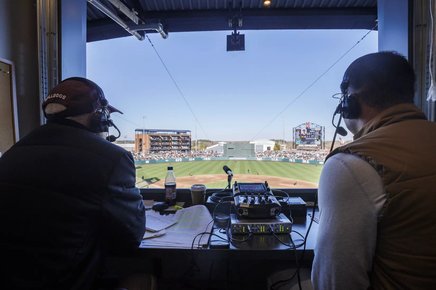 STARKVILLE, MS - February 18, 2022 - Former Mississippi State Outfielder Brent Rooker in the radio booth with Mississippi State Radio Broadcast Announcer Jim Ellis during the game between the Long Beach State Dirtbags and the Mississippi State Bulldogs at Dudy Noble Field at Polk-Dement Stadium in Starkville, MS. Photo By Kevin Snyder