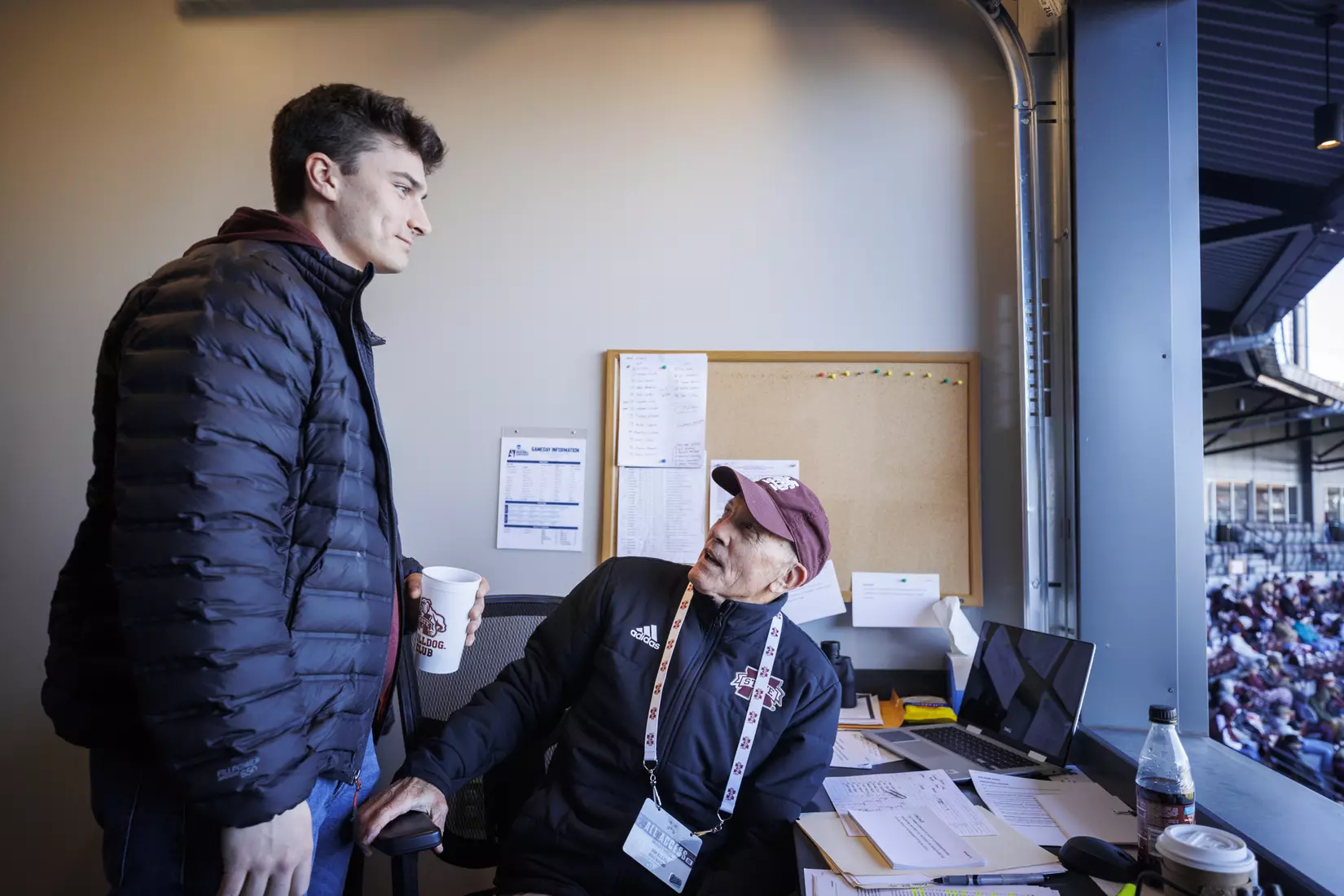STARKVILLE, MS - February 18, 2022 - Former Mississippi State Infielder Justin Foscue with Mississippi State Radio Broadcast Announcer Jim Ellis in the radio booth during the game between the Long Beach State Dirtbags and the Mississippi State Bulldogs at Dudy Noble Field at Polk-Dement Stadium in Starkville, MS. Photo By Kevin Snyder
