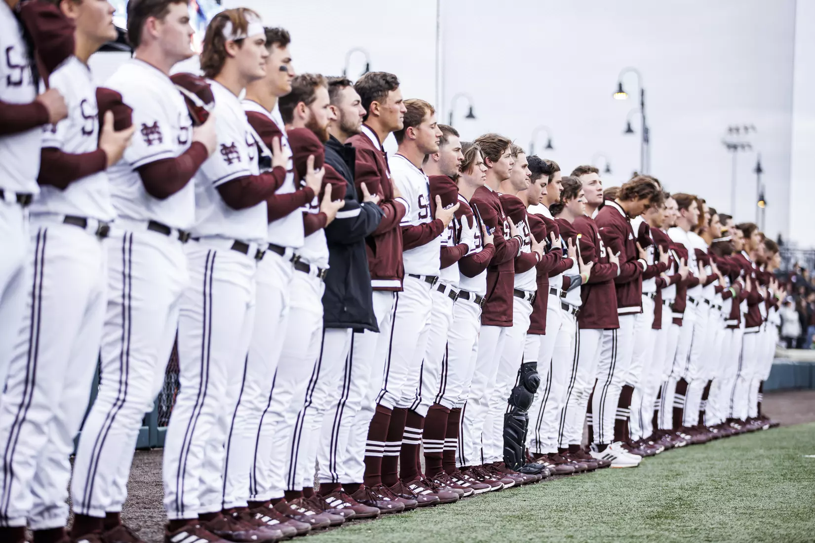 STARKVILLE, MS - February 26, 2022 - The Mississippi State Bulldogs during the National Anthem before the game between the Northern Kentucky Norse and the Mississippi State Bulldogs at Dudy Noble Field at Polk-Dement Stadium in Starkville, MS. Photo By Kevin Snyder