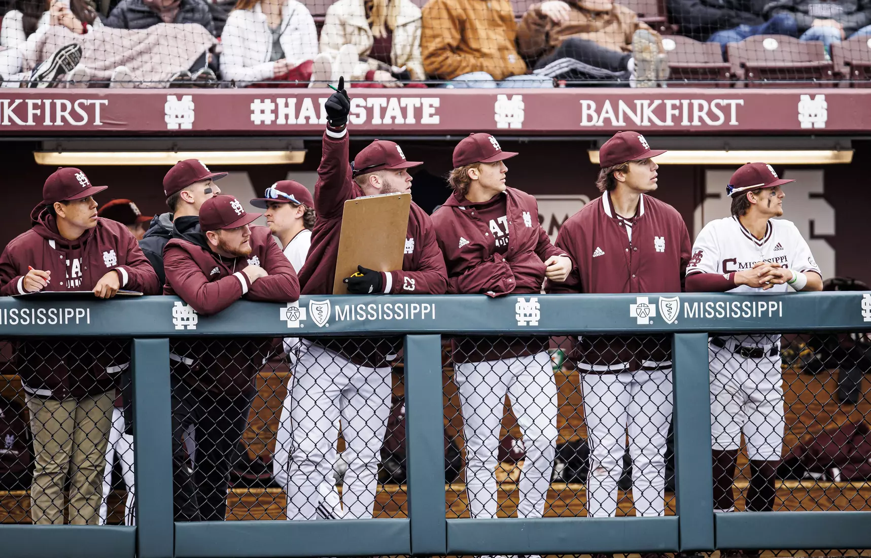 STARKVILLE, MS - February 26, 2022 - Mississippi State Pitcher Landon Sims (#23), Mississippi State Pitcher Jackson Fristoe (#27), Mississippi State Infielder Tanner Leggett (#31) and Mississippi State Infielder Slate Alford (#24) in the dugout during the game between the Northern Kentucky Norse and the Mississippi State Bulldogs at Dudy Noble Field at Polk-Dement Stadium in Starkville, MS. Photo By Kevin Snyder