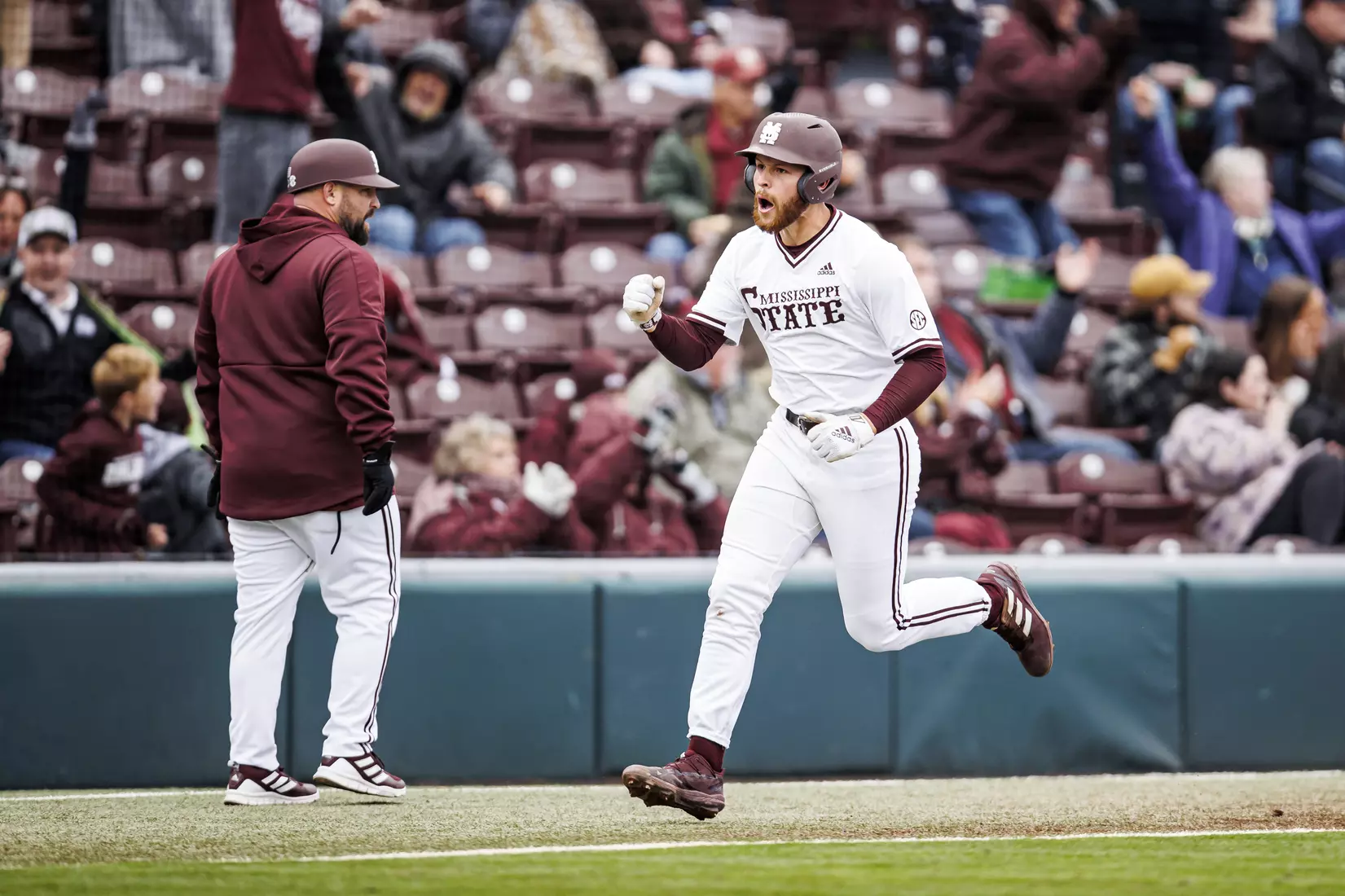 STARKVILLE, MS - February 26, 2022 - Mississippi State Infielder Luke Hancock (#20) celebrates a home run during the game between the Northern Kentucky Norse and the Mississippi State Bulldogs at Dudy Noble Field at Polk-Dement Stadium in Starkville, MS. Photo By Kevin Snyder