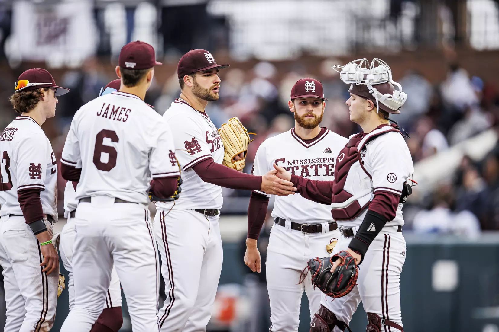 STARKVILLE, MS - February 26, 2022 - Mississippi State Pitcher Preston Johnson (#35), Mississippi State Catcher Logan Tanner (#19), Mississippi State Infielder Luke Hancock (#20), and Mississippi State Infielder Kamren James (#6) during the game between the Northern Kentucky Norse and the Mississippi State Bulldogs at Dudy Noble Field at Polk-Dement Stadium in Starkville, MS. Photo By Kevin Snyder