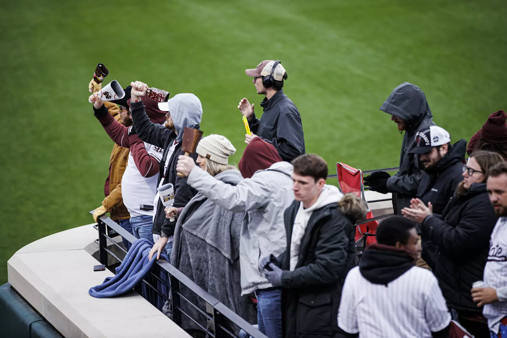 STARKVILLE, MS - February 26, 2022 - Mississippi State fans ring cowbells during the game between the Northern Kentucky Norse and the Mississippi State Bulldogs at Dudy Noble Field at Polk-Dement Stadium in Starkville, MS. Photo By Austin Perryman