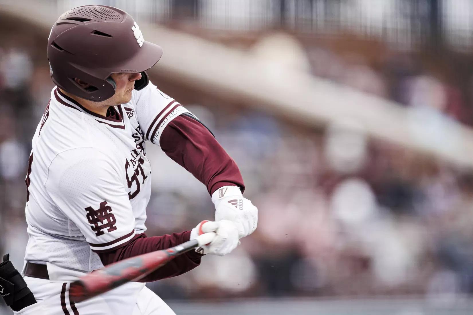 STARKVILLE, MS - February 26, 2022 - Mississippi State Catcher Logan Tanner (#19) hits a home run during the game between the Northern Kentucky Norse and the Mississippi State Bulldogs at Dudy Noble Field at Polk-Dement Stadium in Starkville, MS. Photo By Kevin Snyder
