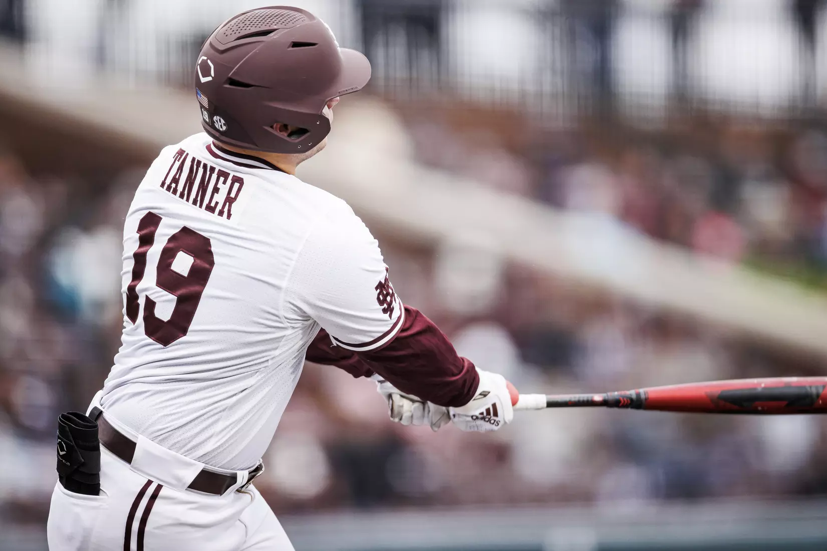 STARKVILLE, MS - February 26, 2022 - Mississippi State Catcher Logan Tanner (#19) hits a home run during the game between the Northern Kentucky Norse and the Mississippi State Bulldogs at Dudy Noble Field at Polk-Dement Stadium in Starkville, MS. Photo By Kevin Snyder