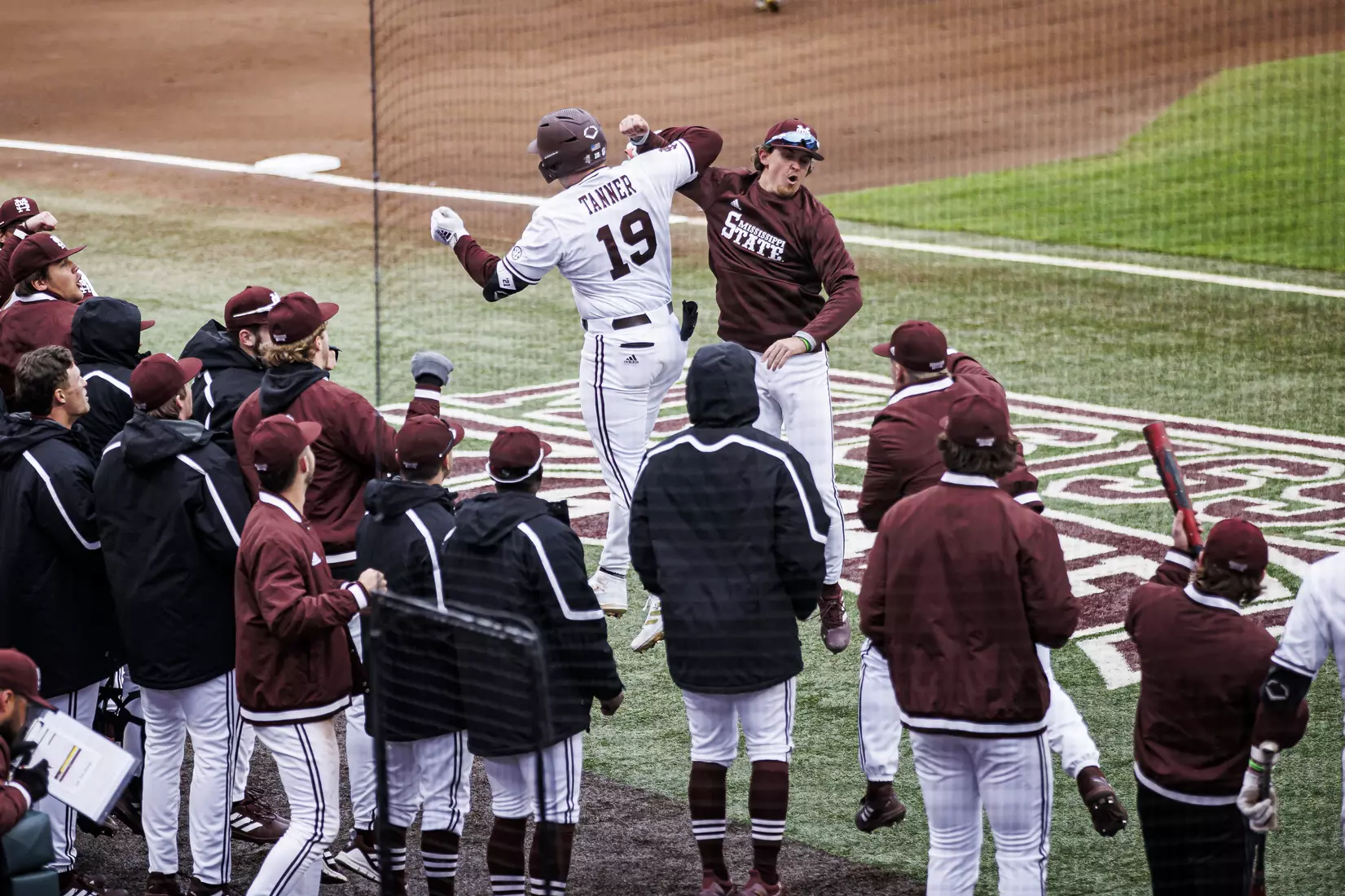 STARKVILLE, MS - February 26, 2022 - Mississippi State Catcher Logan Tanner (#19) and Mississippi State Infielder/Outfielder Matt Corder (#14) celebrate TannerÕs home run during the game between the Northern Kentucky Norse and the Mississippi State Bulldogs at Dudy Noble Field at Polk-Dement Stadium in Starkville, MS. Photo By Austin Perryman