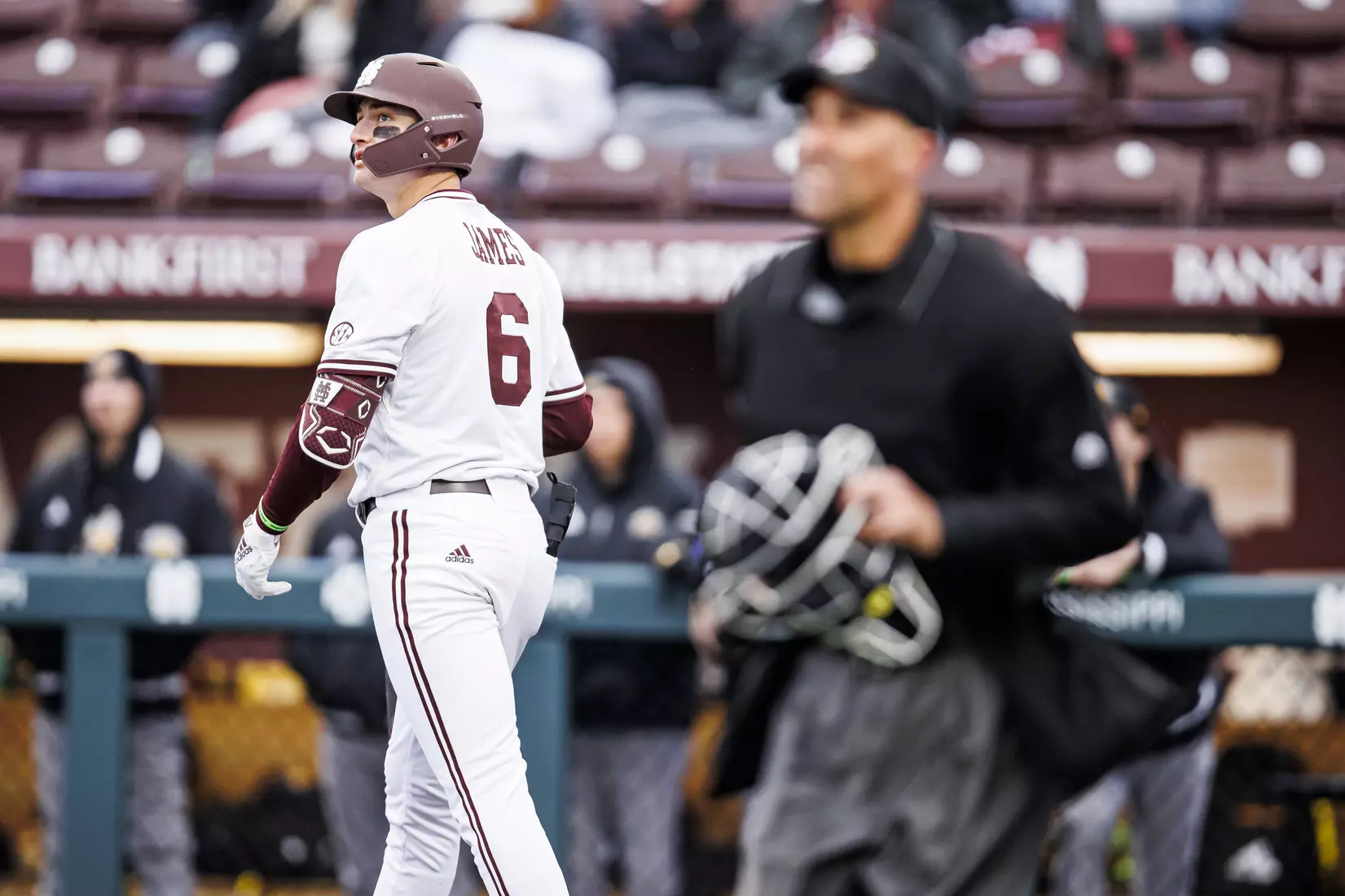 STARKVILLE, MS - February 26, 2022 - Mississippi State Infielder Kamren James (#6) watches a home run clear the fence during the game between the Northern Kentucky Norse and the Mississippi State Bulldogs at Dudy Noble Field at Polk-Dement Stadium in Starkville, MS. Photo By Kevin Snyder